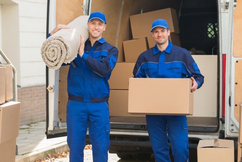 Man with van service loading household items into a van