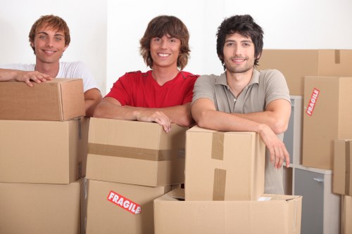 Removal van and moving team preparing a house move in Lewisham