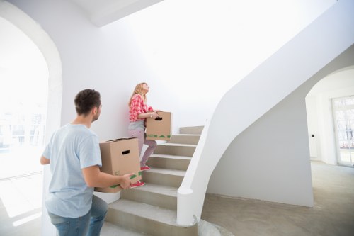 Removal team handling stairs in a Lewisham flat or terrace house